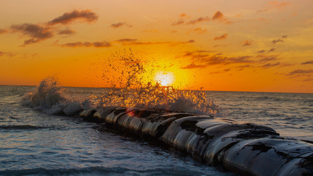 Large pipe ocean sunset water free wallpaper for desktop - medium preview image