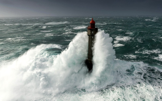 Lighthouse wave ocean island sky free wallpaper for desktop - medium preview image
