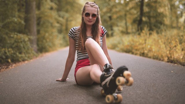 Girl skateboard portrait trees blurry free wallpaper for desktop - medium preview image
