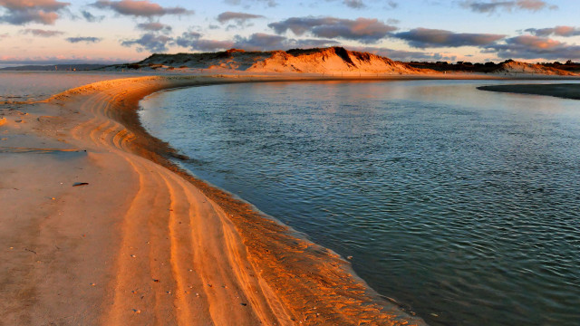 Sandy beach water hill clouds free wallpaper for desktop - medium preview image