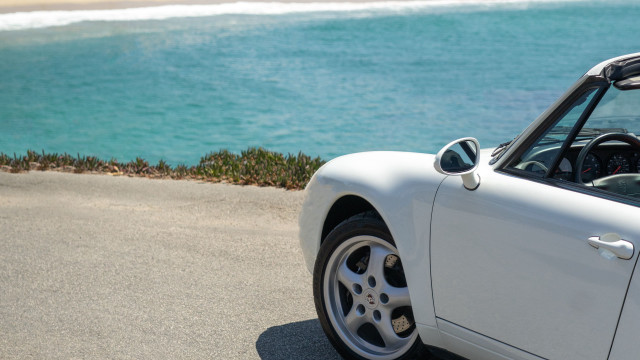 White sports car ocean beach free wallpaper for desktop - medium preview image