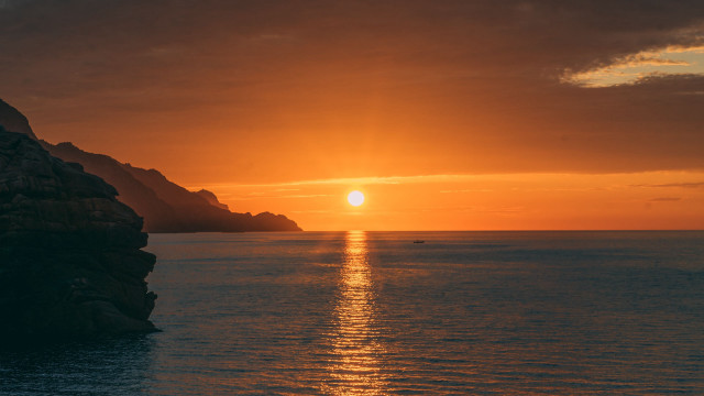 Sunset ocean boat mountain city free wallpaper for desktop - medium preview image