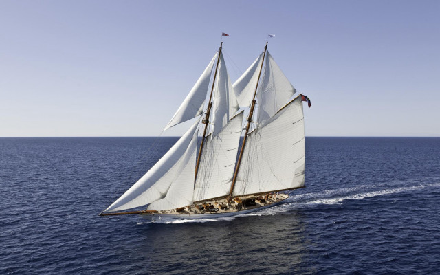 Sailboat open ocean sunny day free wallpaper for desktop - medium preview image