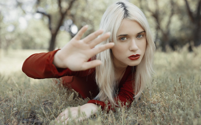 Woman grass outstretched hands portrait free wallpaper for desktop - medium preview image