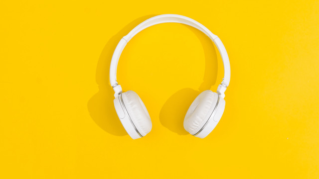 White headphones yellow background shadow free wallpaper for desktop - medium preview image