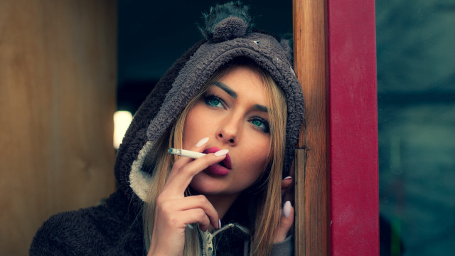 Woman hoodie smoking window portrait free wallpaper for desktop - medium preview image