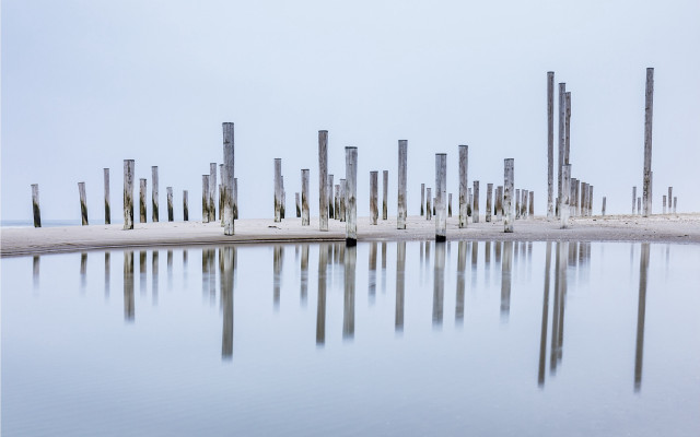 Poles reflection beach land art free wallpaper for desktop - medium preview image
