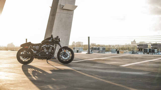 Motorcycle parking lot tall building free wallpaper for desktop - medium preview image