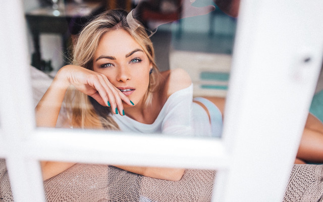 Woman couch window hand chin free wallpaper for desktop - medium preview image