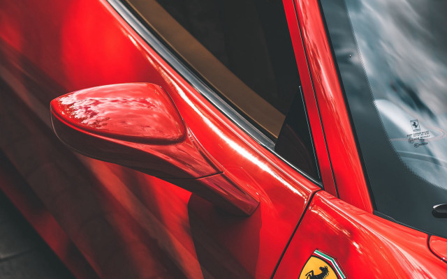Red ferrari emblem car door free wallpaper for desktop - medium preview image