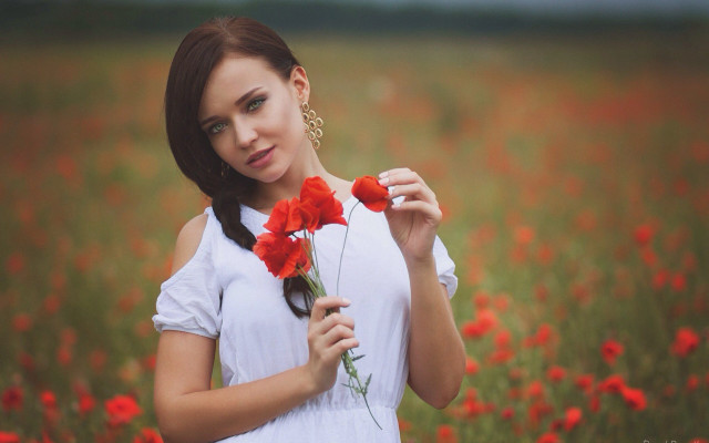Woman flower field serious portrait #2 free wallpaper for desktop - medium preview image