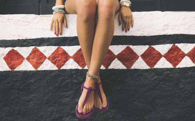 Woman sitting wall crossed sandals free wallpaper for desktop - medium preview image