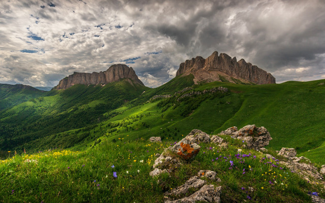 Grassy field mountain cloudy sky #2 free wallpaper for desktop - medium preview image