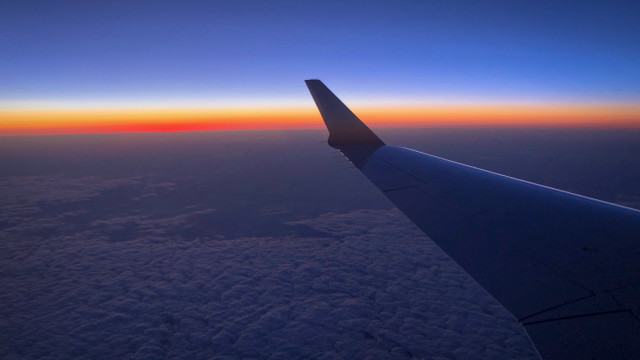 Plane wing sunset ocean horizon free wallpaper for desktop - medium preview image