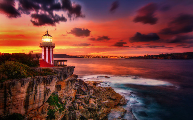 Lighthouse cliff ocean sunset mystical free wallpaper for desktop - medium preview image