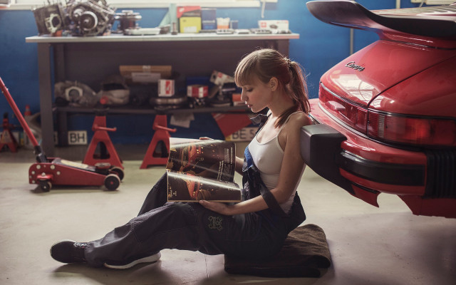 Woman sitting garage reading car free wallpaper for desktop - medium preview image