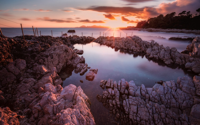 Sunset rocky beach water fence free wallpaper for desktop - medium preview image