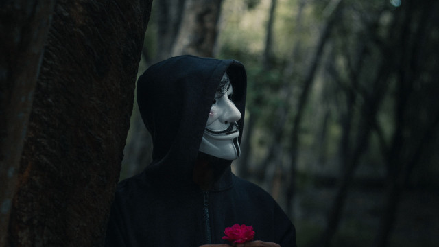 Masked figure flower forest sinister free wallpaper for desktop - medium preview image