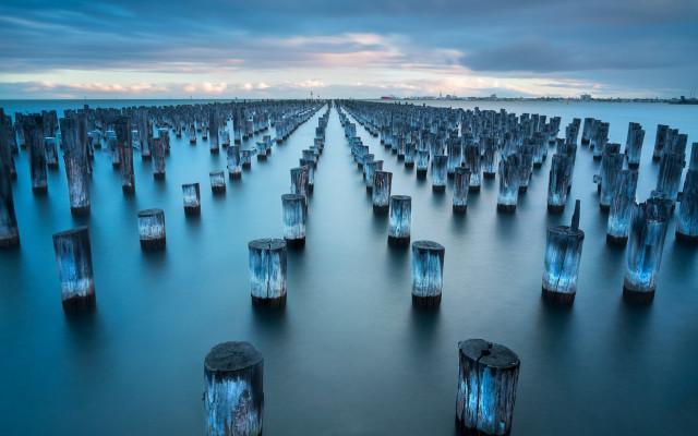 Water wooden posts sky cityscape free wallpaper for desktop - medium preview image