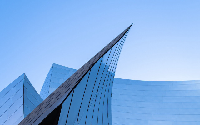 Curved building blue sky plane free wallpaper for desktop - medium preview image