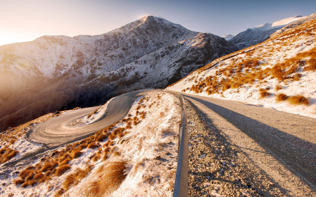 Snowy mountain road sunset ocean free wallpaper for desktop - medium preview image
