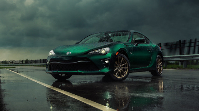 Green sports car wet road free wallpaper for desktop - medium preview image