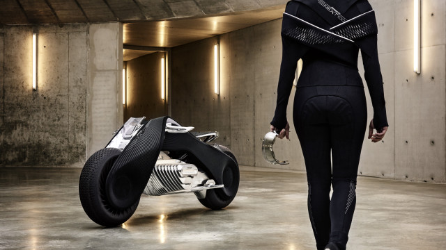 Woman black outfit walking motorcycle free wallpaper for desktop - medium preview image