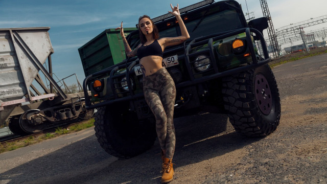 Woman black top camouflage pants free wallpaper for desktop - medium preview image
