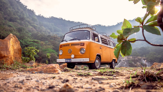 Yellow bus dirt road forest free wallpaper for desktop - medium preview image