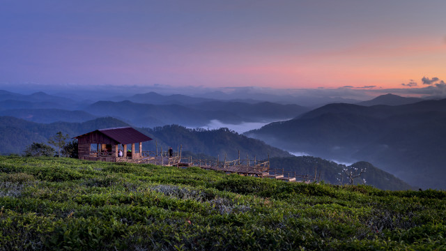 Small cabin grassy hill mountains #2 free wallpaper for desktop - medium preview image