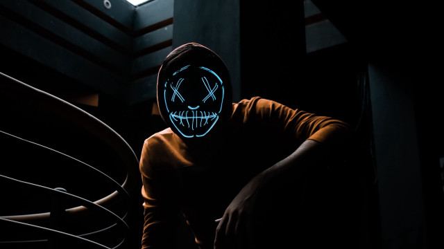 Glowing mask dark hoodie sinister free wallpaper for desktop - medium preview image