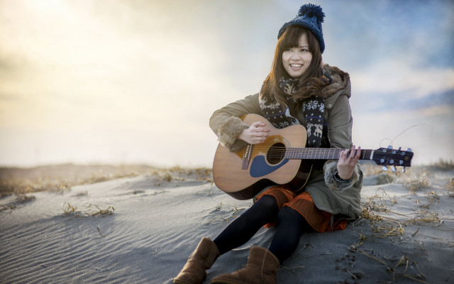Woman sitting guitar beach smiling free wallpaper for desktop - medium preview image