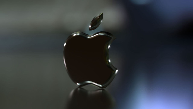 Shiny apple logo table blurry free wallpaper for desktop - medium preview image