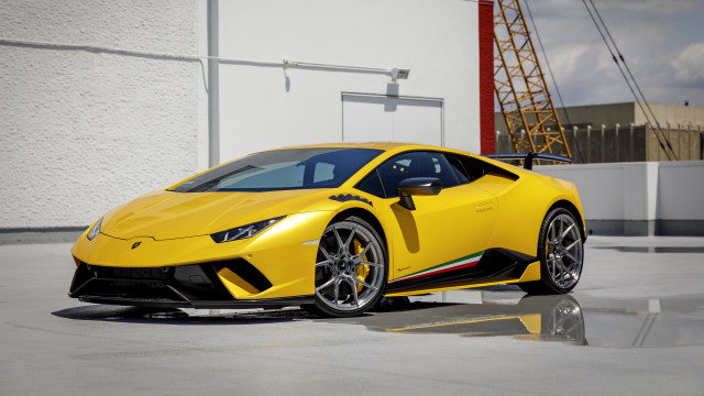 Yellow sports car building crane free wallpaper for desktop - medium preview image