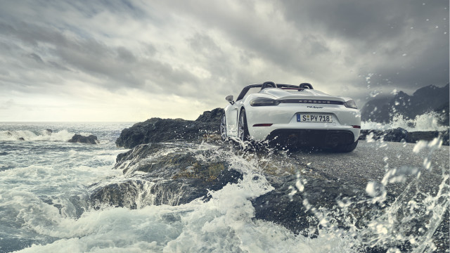 White sports car rocky shore free wallpaper for desktop - medium preview image