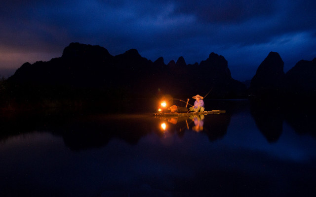 Man boat night flashlight tent free wallpaper for desktop - medium preview image
