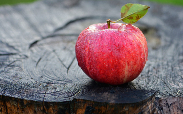 Red apple wooden table leafy free wallpaper for desktop - medium preview image