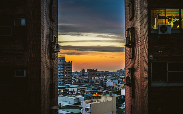 Cityscape sunset dawn skyscrapers ocean free wallpaper for desktop - medium preview image