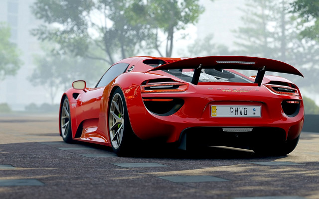 Red sports car foggy street free wallpaper for desktop - medium preview image