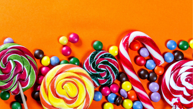 Candy lollipops orange background maximalism free wallpaper for desktop - medium preview image