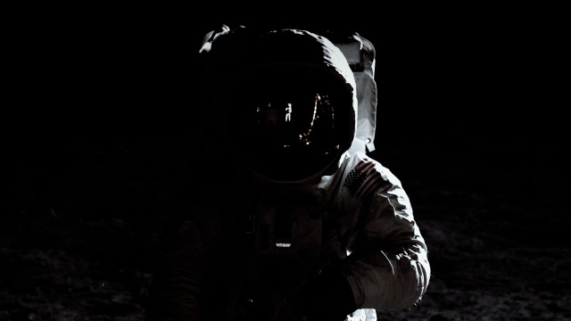 Space suit astronaut dark flashlight free wallpaper for desktop - medium preview image
