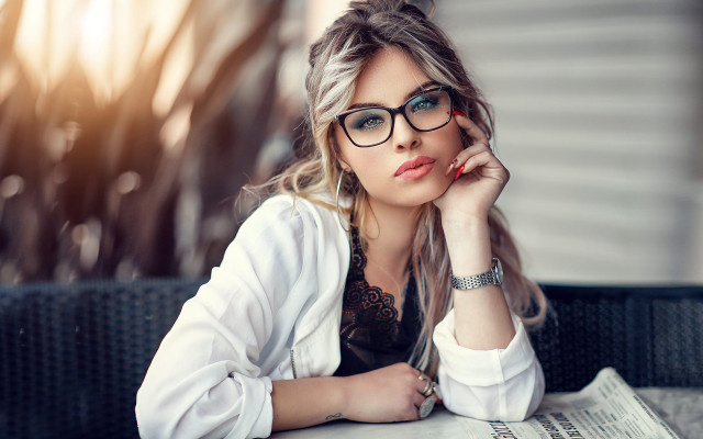 Woman glasses newspaper portrait blurry free wallpaper for desktop - medium preview image