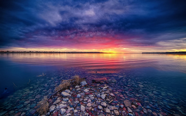 Sunset water rocks cloudy sky free wallpaper for desktop - medium preview image