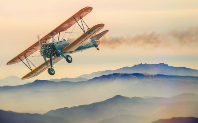 Small airplane dieselpunk mountains orange free wallpaper for desktop - medium preview image