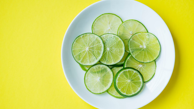 Sliced limes yellow background white free wallpaper for desktop - medium preview image