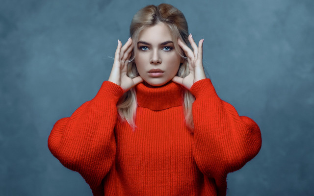 Serious woman red sweater blue free wallpaper for desktop - medium preview image