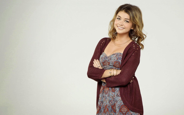 Woman smiling crossed arms floral free wallpaper for desktop - medium preview image