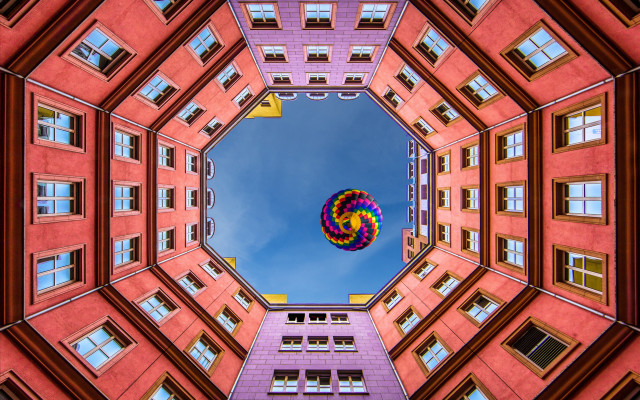 Colorful kite blue sky building free wallpaper for desktop - medium preview image