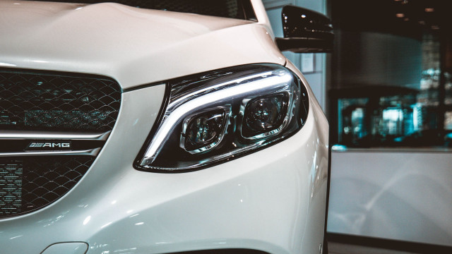 White car black grill headlights free wallpaper for desktop - medium preview image