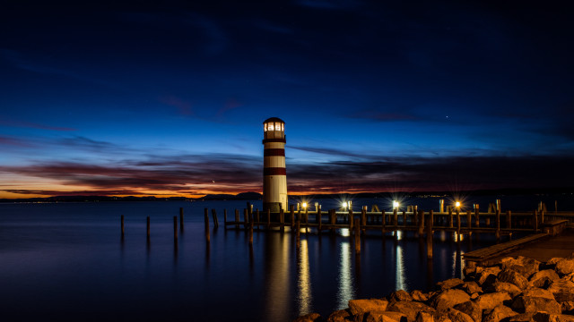 Lighthouse night water bridge city free wallpaper for desktop - medium preview image